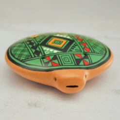 Inca Ocarina -CARVED CULTURE Sale Close up of the green clay inca ocarina showing the mouth piece