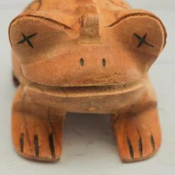 Jati Frog Guiro - 5" -CARVED CULTURE Sale Close up of the jati frog guiro face