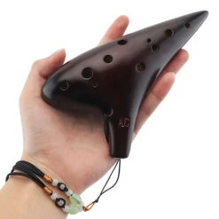 Dorado Ocarina -CARVED CULTURE Sale Holding the marine ocarina