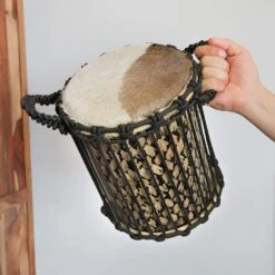 Kenkeni Dundun Drum -CARVED CULTURE Sale Kenkeni Dundun Drum held in hand to show scale